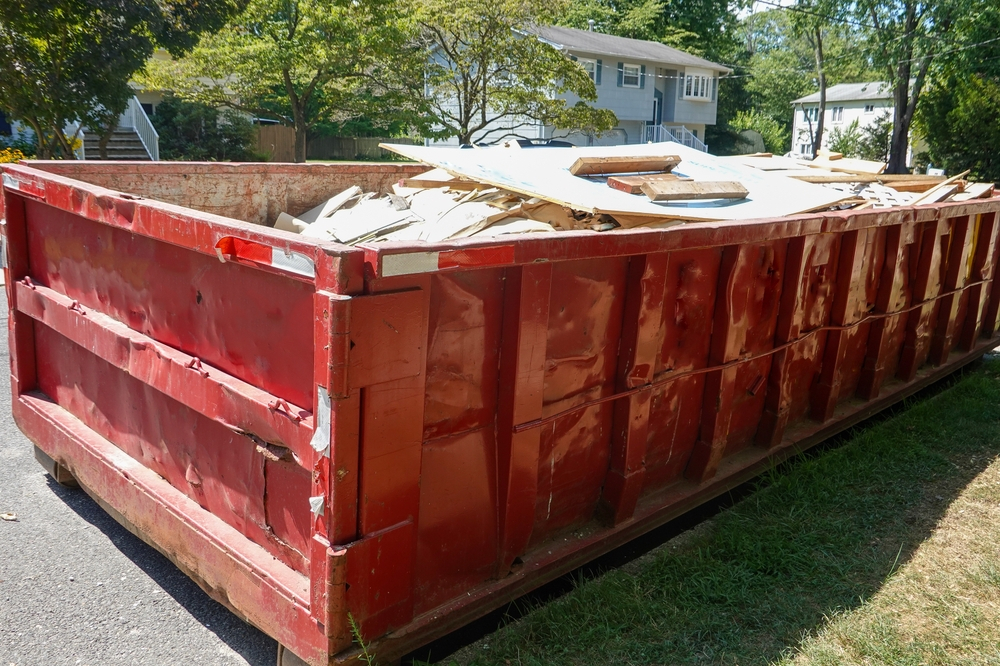 red-dumpster-full-building-debris-
